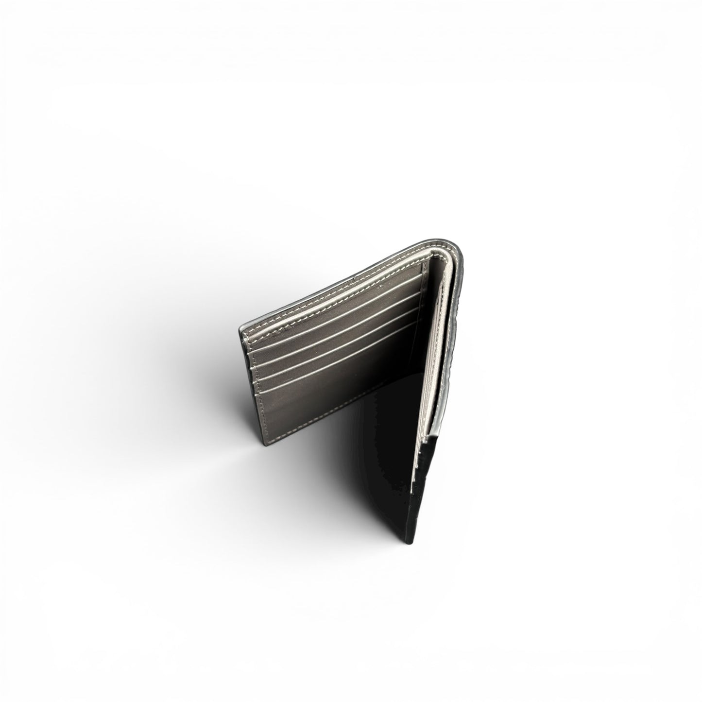 GUCCI GG EMBOSSED LEATHER WALLET