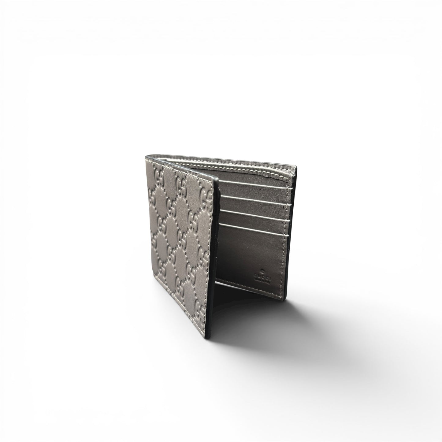 GUCCI GG EMBOSSED LEATHER WALLET